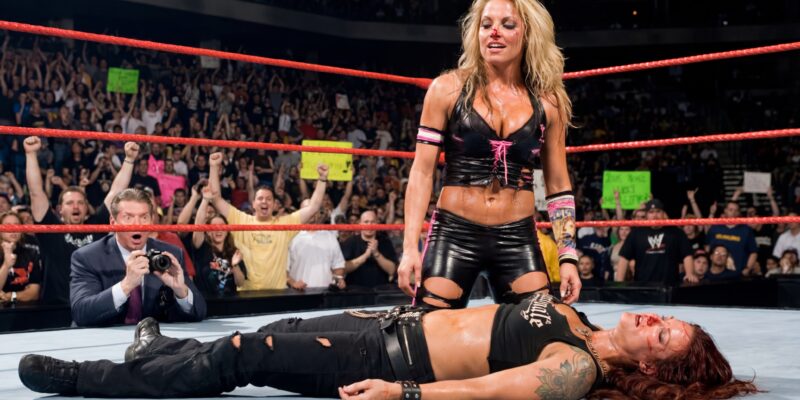 Trish Stratus French Kissing a Defeated Lita